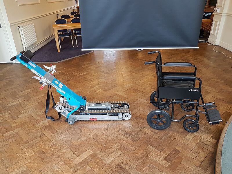 Image shows a type of evacuation chair used for a person in a wheelchair.