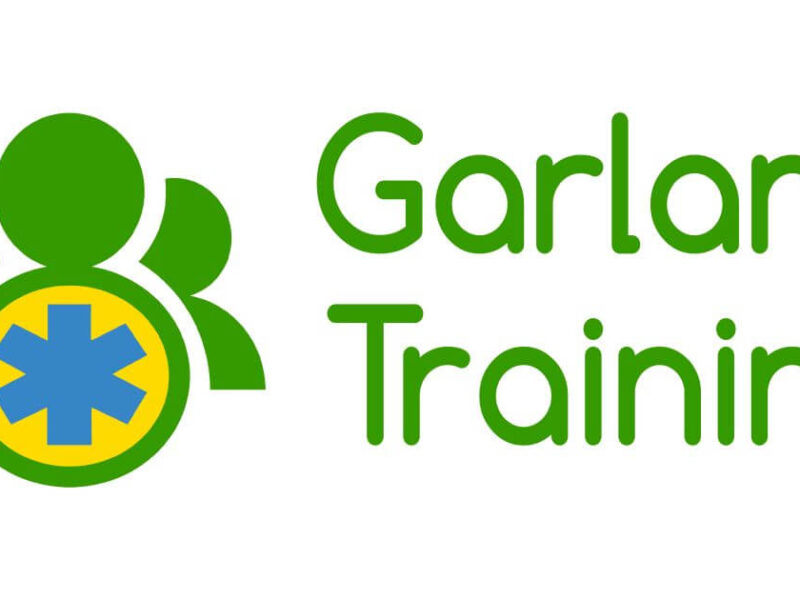 Garland Training official logo featuring a green three-person icon with a blue Star of Life medical cross on a white background.