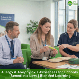 A trainer demonstrates how to use an adrenaline auto-injector pen to school staff during an Allergy and Anaphylaxis Awareness training course (Benedict's Law) by Garland Training.
